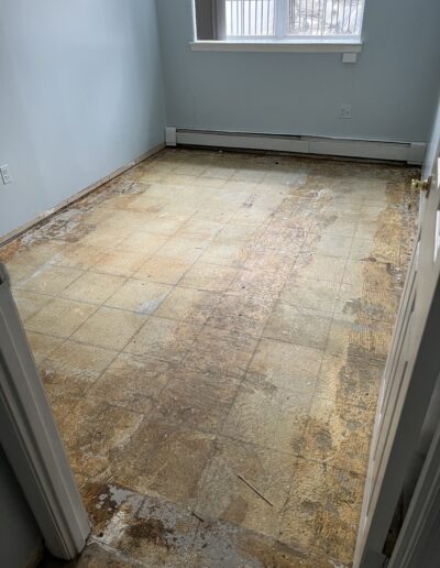 image shows a room with a tiled floor that looks like it's in the process of being renovated