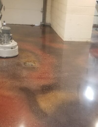 a man is polishing a floor using machine